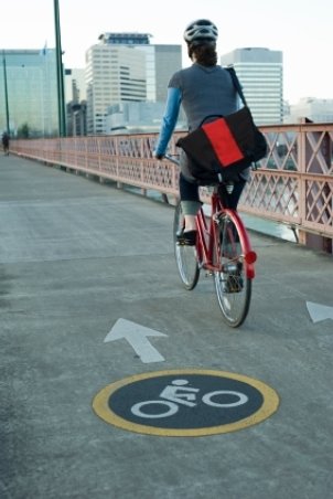 City girl riding a road bike