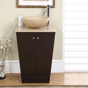 Auburn marble vessel sink on a brown vanity