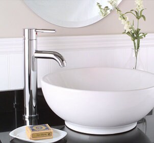 White porcelain vessel sink on a grey countertop