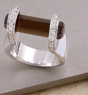 Stylish jewelry ring with a smokey quartz gemstone and sparkling diamonds