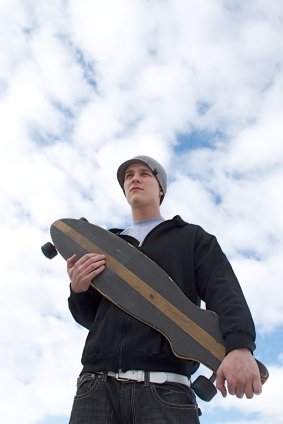 A longboarder preparing for longboard maintenance