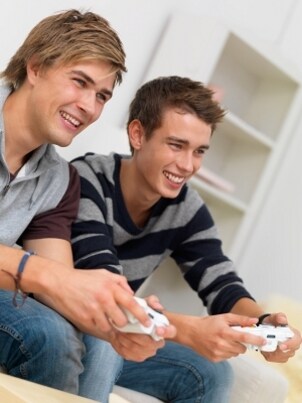 Boys playing games on a gaming television