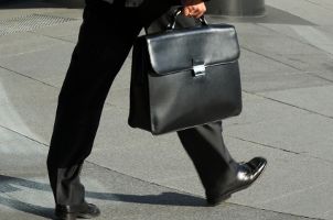 Man wearing extra-wide men's dress shoes to the office