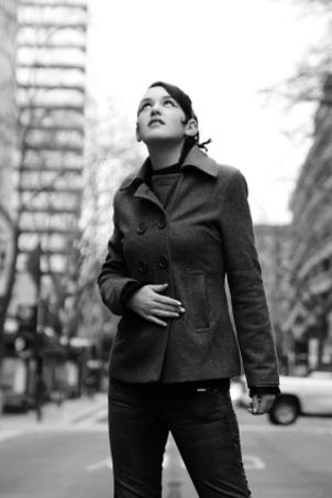 Woman wearing a peacoat in the city