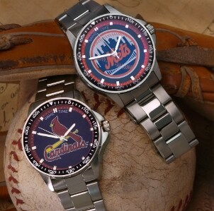 Two watches with stainless steel watchbands resting on a well-worn baseball and baseball glove