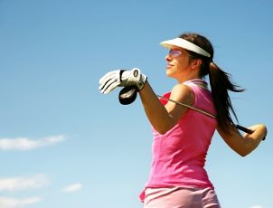 Woman wearing pink golf clothing