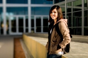 College student wearing a light fall jacket