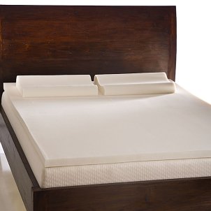 Wooden platform bed with a comfortable memory foam mattress topper