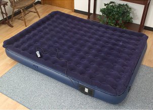 Blue air mattress in the guest bedroom