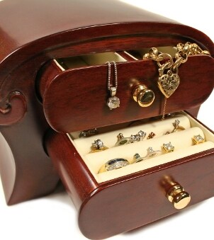 Gorgeous wood jewelry box containing a lovely jewelry wardrobe