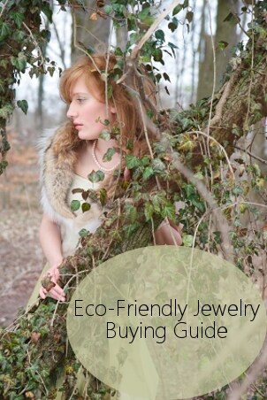 A lovely redhead wears eco-friendly jewelry and a vintage party dress in the woods