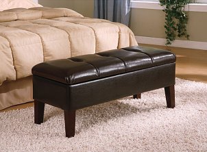 A leather storage bench in the bedroom