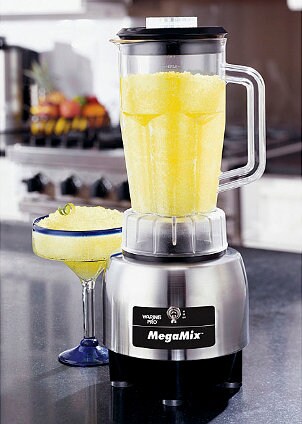 Brushed-steel blender with yellow slushy drink