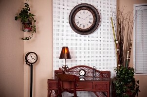 Elegant home office space with large wall clock, floor clock and desk clock, all perfect for either home or office