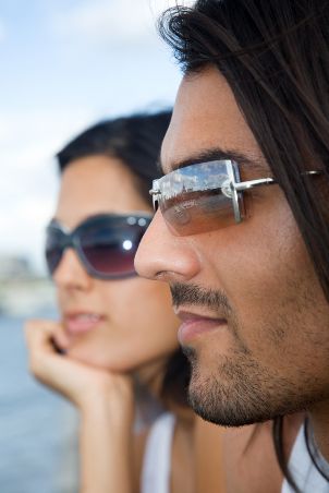Man and woman wearing stylish sunglasses