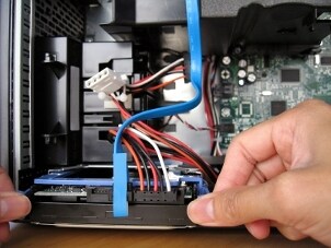 Technician installing multiple hard drives