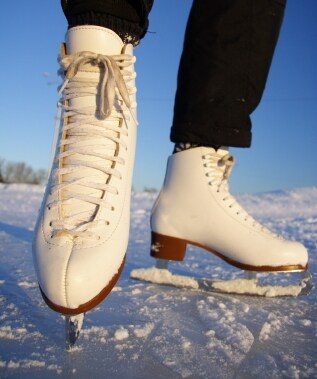 Recreational ice skater on a frozen lake