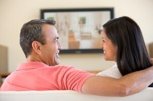 Couple watching an HDTV at home