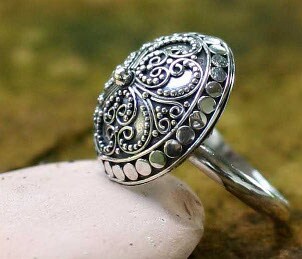 A beautiful domed sterling silver ring represents the sterling jewelry craze