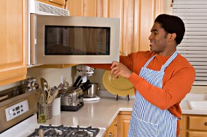 Man cooking with large appliances in his kitchen