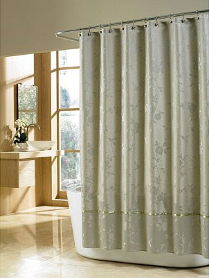 A cloth shower curtain in soothing sage
