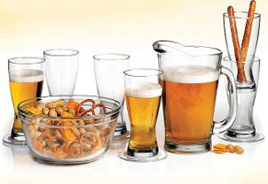 Full pitcher of beer and glasses ready to be filled