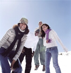 Young people wearing snow boots in the snow