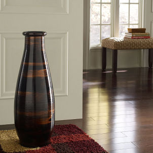Brown floor vase complements hardwood floor