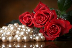 Red roses and a strand of pearls for Valentine's Day