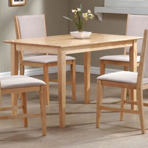 Light wooden dining table with padded chairs