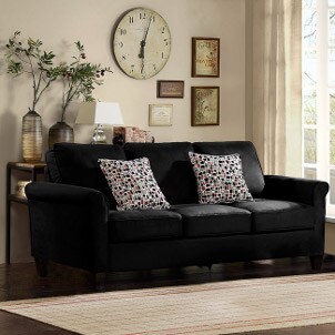 Decorated living room with black sofa