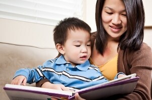Mother and son reading a kids' book together