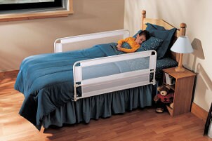 Boy asleep in toddler bed