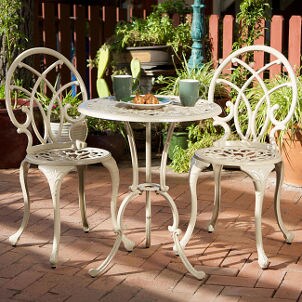 White aluminum bistro set on a patio