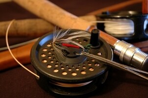 Fly-fishing reel and fly