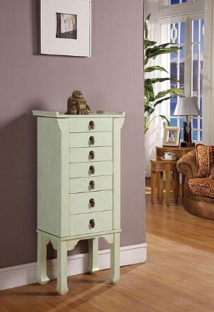 A stylish rustic green jewelry armoire