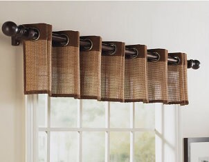 A wooden curtain rod adds elegance