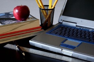 Desk full of school supplies Desk full of school supplies